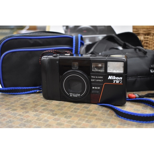 187 - Minolta X-300 SLR camera with Tamron, CF Tele Macro 1:3.8 80-210mm lens, three 35 mm pocket cameras ... 