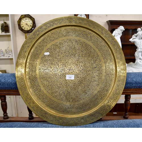 190 - Indian floral-engraved circular brass tray, 53 cm diam