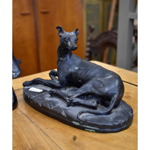 194 - Bronzed figure of a grape-picker, 16 cm high to/w a bronzed recumbent lurcher, 12 cm high (2)