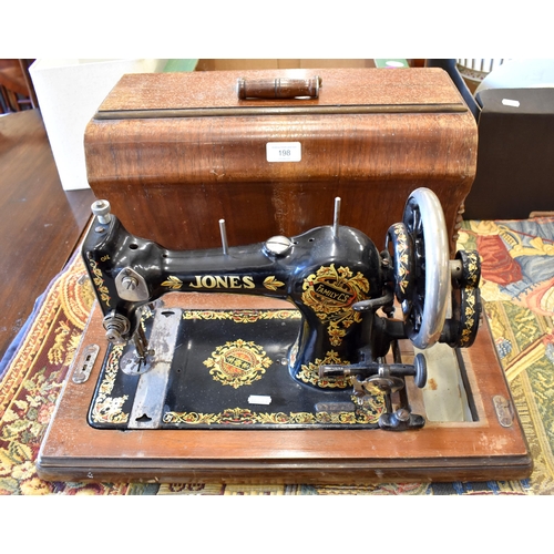 198 - An antique Jones sewing machine with rosewood centre