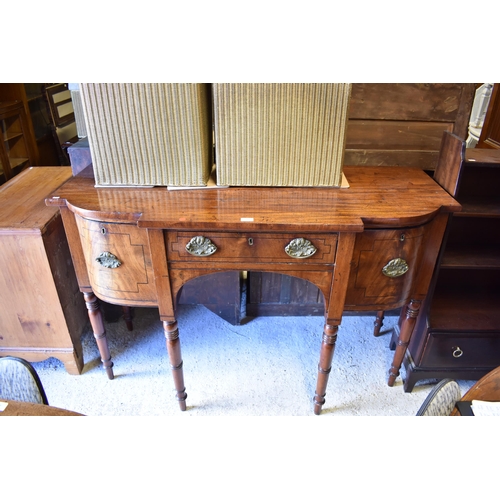 509 - A George III mahogany breakfront sideboard, centred by a drawer flanked by deep drawers either side,... 