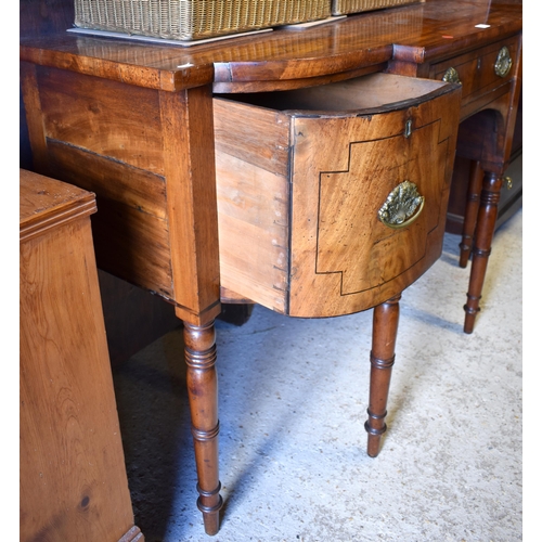 509 - A George III mahogany breakfront sideboard, centred by a drawer flanked by deep drawers either side,... 