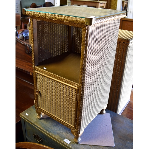 510 - Original Lloyd Loom 'Lusty' range (gold) - two laundry baskets, a bedside cabinet, an ottoman and a ... 