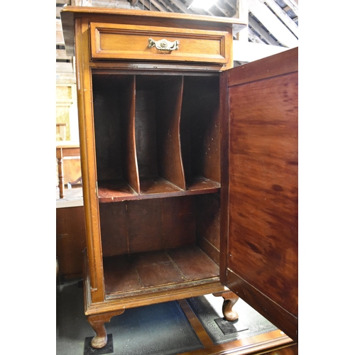 516 - A mahogany stationery cabinet with single drawer over panelled cupboard, on short cabriole supports,... 