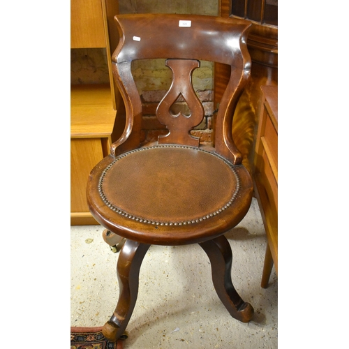 520 - An antique revolving chair with studded leatherette seat to/with a Captains chair with a Lloyd Loom ... 