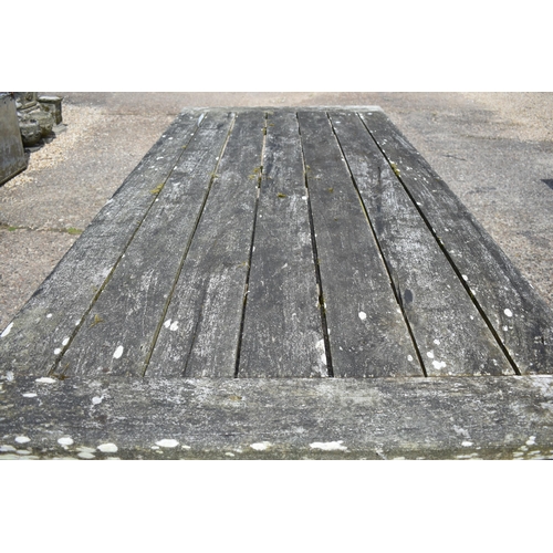 62 - A large weathered teak garden dining table by 'Chic Teak', with cleated rectangular top on square le... 