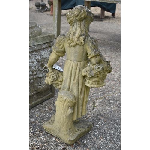 71 - A small weathered reconstituted stone garden figure of a young girl carrying baskets of flowers, 75 ... 