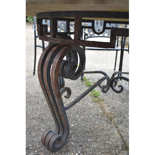 74 - A substantial Regency style circular limestone top on wrought iron base terrace table, 156 cm dia. x... 