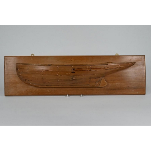 179 - A Victorian carved wood half-hull model of a clinker-built yacht, 64 cm, mounted on a later plaque