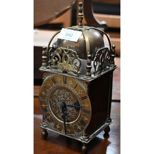 181 - A reproduction brass lantern clock in the 17th century style, 24 cm high