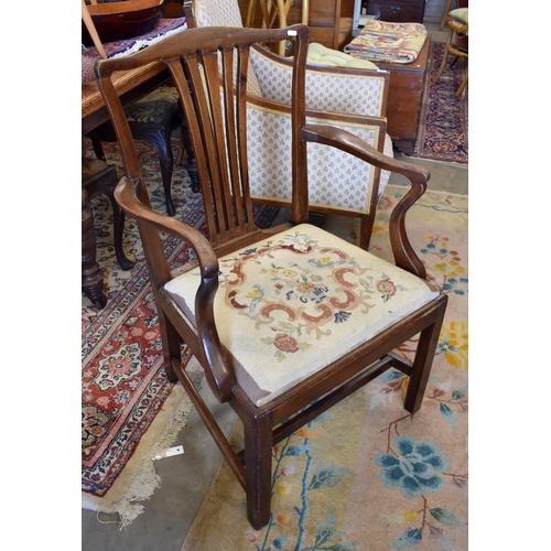 521 - A mahogany carver chair with needlepoint upholstered pad seat