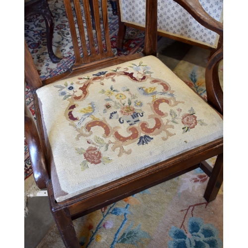 521 - A mahogany carver chair with needlepoint upholstered pad seat