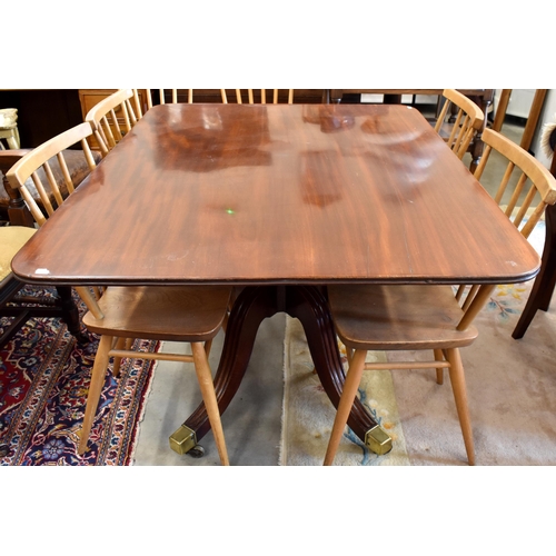 522 - A Victorian mahogany tilt top dining table with brass casters, 121 x 93 x 71 cm