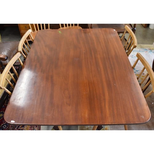 522 - A Victorian mahogany tilt top dining table with brass casters, 121 x 93 x 71 cm