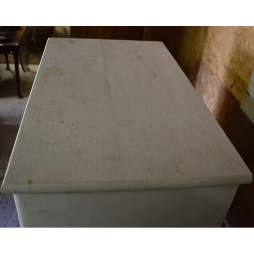 500 - A grey painted chest of 4 long drawers, raised on turned feet, 77 cm w x 46 cm x 74 cm h