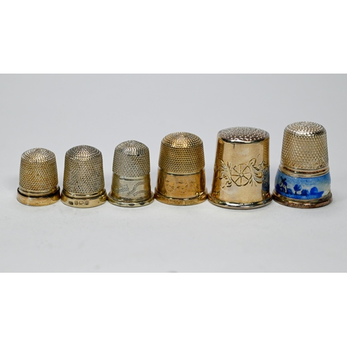 26 - Five silver thimbles and an unmarked example, to/w a letter-knife, silver-handled penknife, pill box... 