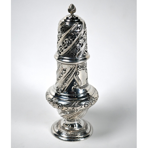36 - A Victorian silver baluster caster with flame finial and embossed decoration, Martin Hall & Co, Lond... 