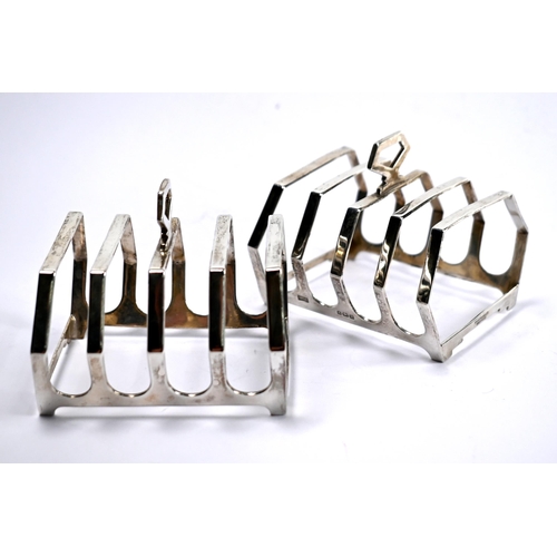 44 - A pair of Art Deco silver toast-racks, Walker & Hall, Birmingham 1937, to/w three small pin-dishes, ... 