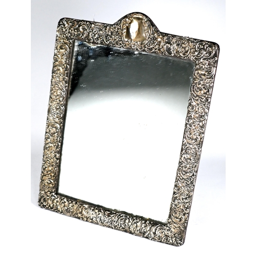 50 - A large Edwardian silver-faced easel mirror with foliate-embossed decoration, Cohen & Charles, Birmi... 