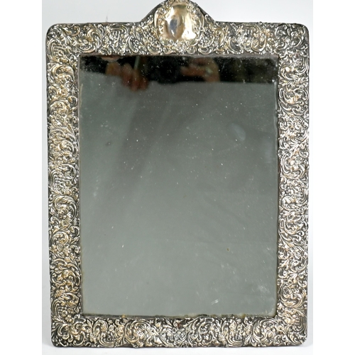 50 - A large Edwardian silver-faced easel mirror with foliate-embossed decoration, Cohen & Charles, Birmi... 