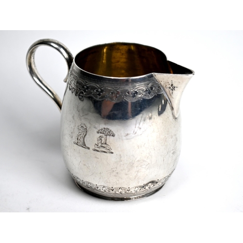 56 - Victorian silver ovoid jug with foliate-engraved decoration and scroll handle, Henry Holland, London... 