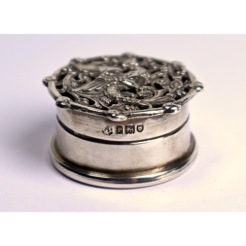 62 - A small cylindrical silver pomander, the pierced cover cast with a gryphon, London 1910, 3.5cm diame... 