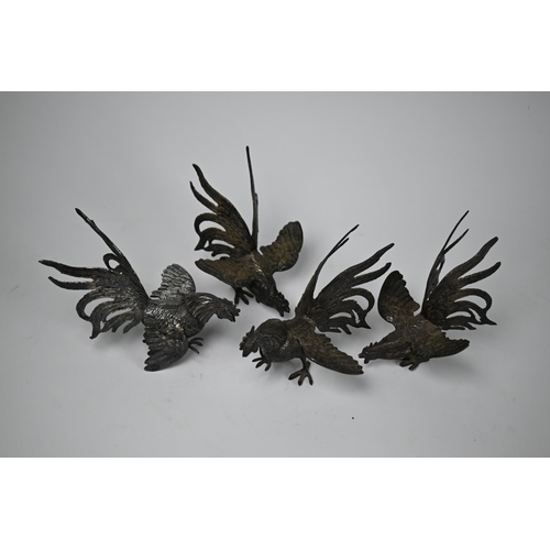 6A - A set of four Continental white metal 'fighting cock' table ornaments, 12.5cm high (not testing as s... 