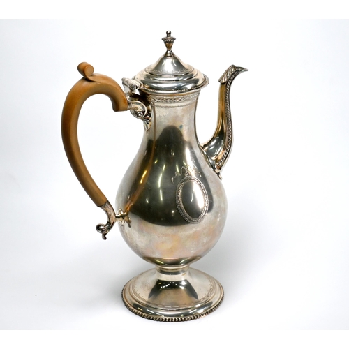 73 - A silver coffee pot in the Georgian manner, of baluster form with engraved and beaded decoration and... 