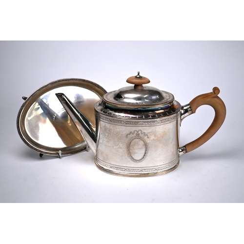 74 - An oval silver teapot in the Georgian manner with beaded rims and engraved decoration, C.J. Vander L... 