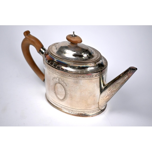 74 - An oval silver teapot in the Georgian manner with beaded rims and engraved decoration, C.J. Vander L... 