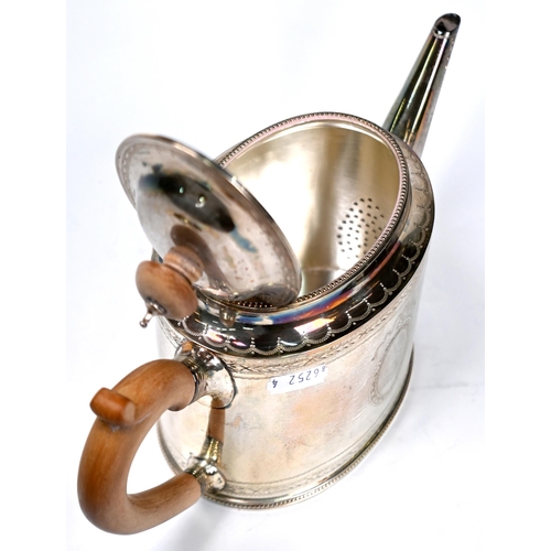 74 - An oval silver teapot in the Georgian manner with beaded rims and engraved decoration, C.J. Vander L... 