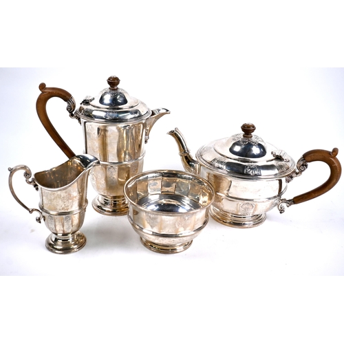 78 - A heavy quality four-piece silver tea service with engraved decoration and composite handles and fin... 