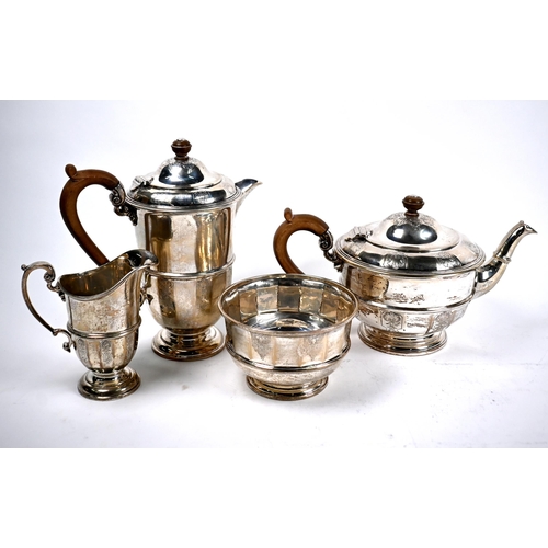 78 - A heavy quality four-piece silver tea service with engraved decoration and composite handles and fin... 