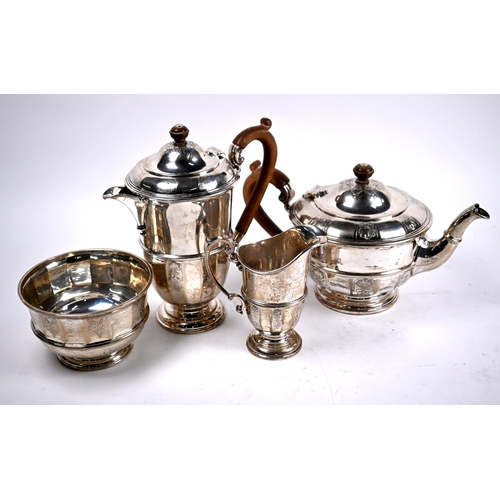 78 - A heavy quality four-piece silver tea service with engraved decoration and composite handles and fin... 