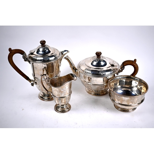 78 - A heavy quality four-piece silver tea service with engraved decoration and composite handles and fin... 