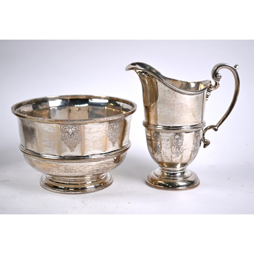 78 - A heavy quality four-piece silver tea service with engraved decoration and composite handles and fin... 