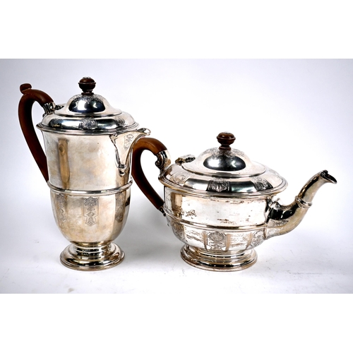 78 - A heavy quality four-piece silver tea service with engraved decoration and composite handles and fin... 