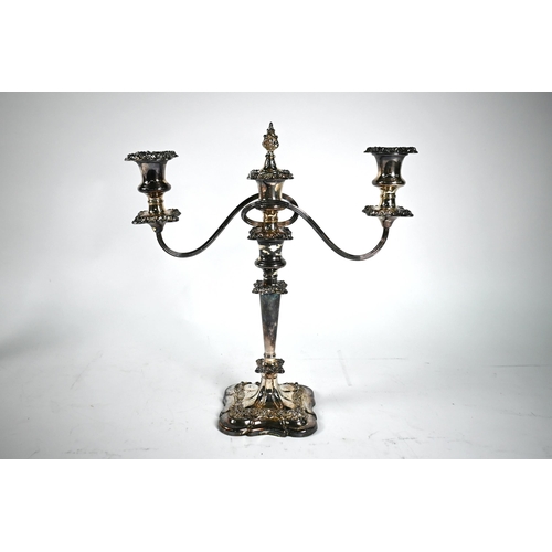 9A - Large silver plated four-branch candelabrum with five sconces and flame finial on foliate-embossed b... 