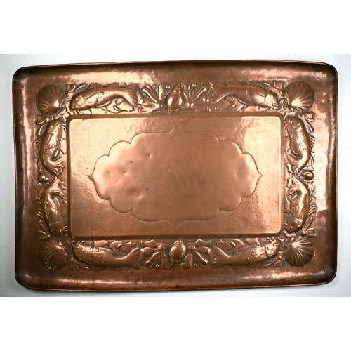 1238 - An Arts & Crafts Newlyn copper tray, the border worked with fish, scallops and whelks, stamped 'Newl... 