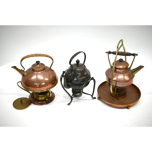 1243 - An Art Nouveau planished copper and brass kettle with burner on organic stand, embossed with stylise... 