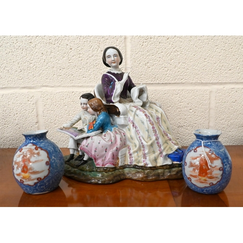 101 - A late 19th century Continental porcelain group of a domestic scene with mother sewing, her children... 