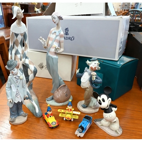 110 - A boxed Lladro 'Clown in Love' 35 cm and a Nao Harlequin 37 cm (also boxed) to/w a smaller Lladro cl... 