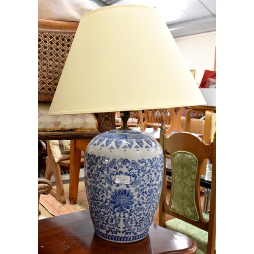 137 - Chinese blue and white floral-printed ovoid vase, 31 cm high, mounted as a table lamp to/w a carved ... 