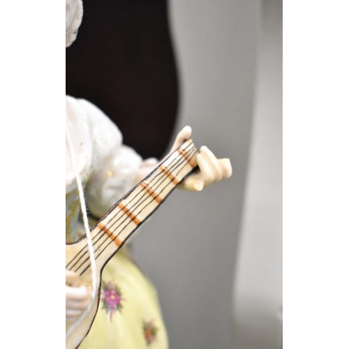 146 - A pair of late 19th century German porcelain figures, 18th century man with flute and lady with lute... 