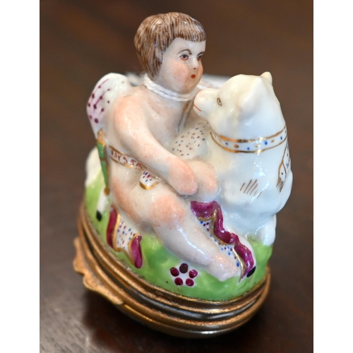 149 - A 19th century French porcelain bonbonniere with gilt metal hinges, modelled as Cupid with lamb, the... 