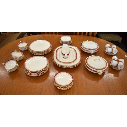 171 - An Aynsley china part dinner/coffee service for eight settings, with puce and gilt borders