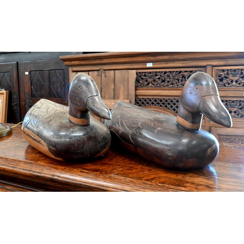 181 - Two carved hardwood duck decoys (not antique), 38 cm to/w a pair of brass classical urn chenets (4)