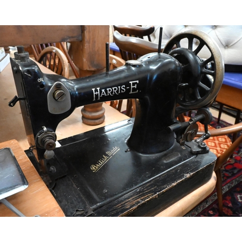 186 - A Harris-E vintage hand-driven sewing machine, to/w a Singer sewing machine as a table lamp and a to... 