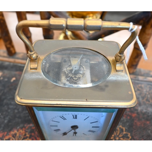 189 - A brass carriage clock, striking on a coiled gong, 17 cm high o/a