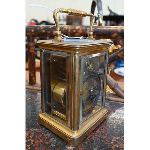 189 - A brass carriage clock, striking on a coiled gong, 17 cm high o/a